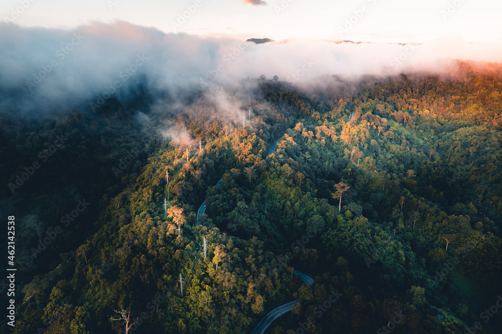 The sun rises in the mist and mountains in the morning The sun rises in the mist and mountains in the morning