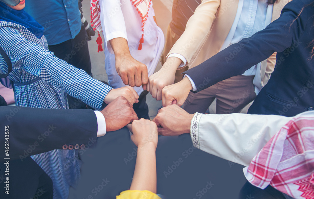 Diverse multiethnic Partners hands together teamwork group of multi racial people meeting join hands togetherness. Diversity people hands join empower partnership teams connection volunteer community