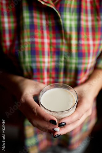 Female hands with glasse of vegan milk, Alternative types of non-dairy milks, plant milk made of various grain, Clean eating, Healthy diet..