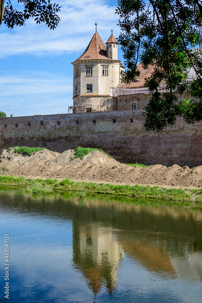 Renovated old historical buildings of Fagaras Fortress (Cetatea Fagaras) during renovation works in a sunny summer day, in Transylvania (Transilvania) region, Romania . Renovated old historical buildings of Fagaras Fortress (Cetatea Fagaras) during renovation works in a sunny summer day, in Transylvania (Transilvania) region, Romania .