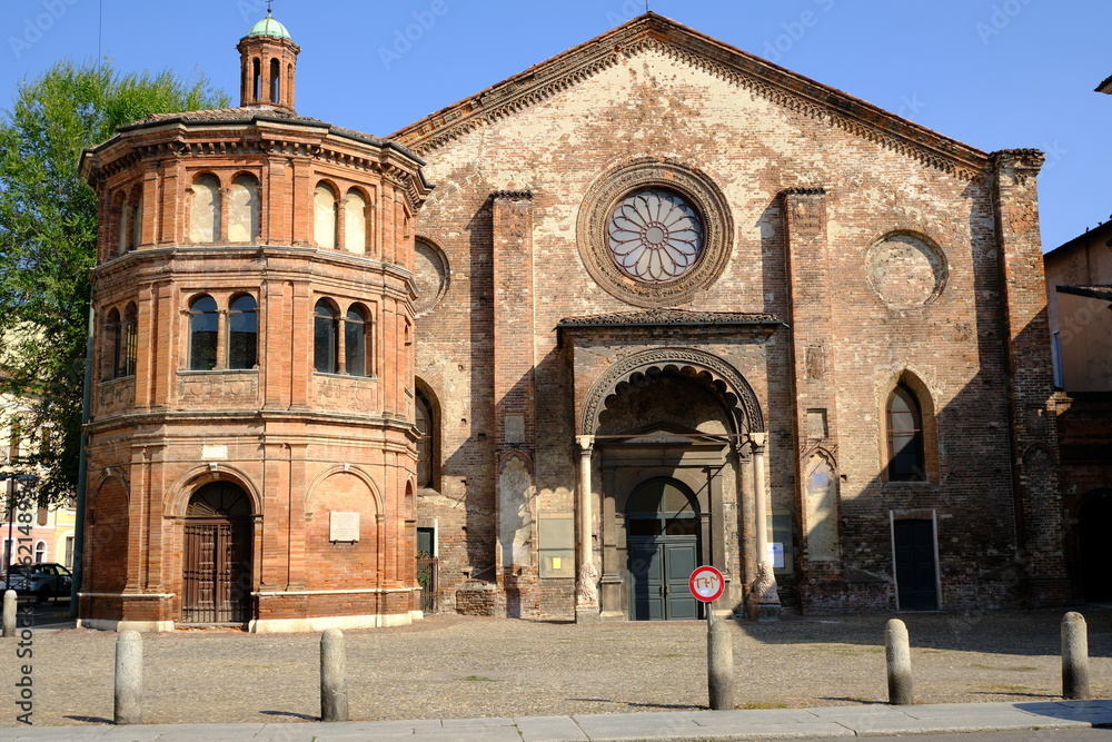 Fototapeta premium Romanesque church. Romanesque brick church.San Luca di Cremona is an ancient church with a superfetation of the octagonal Tempietto del Risorto. 