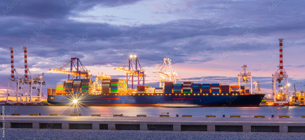 Fototapeta premium Cargo ship parking at seaport waiting for container dock crane shipment harbour loading container boxes import and export commercial trade business logistic and transportation of internationa