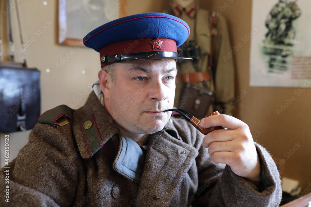 Serious NKVD officer with smoking pipe Stock Photo | Adobe Stock