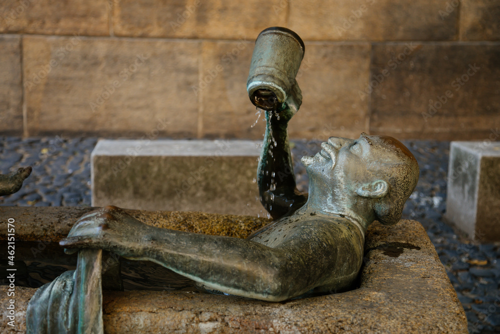 Goerlitz, Saxony, Germany, 04 September 2021: Fountain Das Zecherpaar or reveler couple, stone bath with sculptures of man with mug of beer and woman washing clothes in medieval city at summer day Goerlitz, Saxony, Germany, 04 September 2021: Fountain Das Zecherpaar or reveler couple, stone bath with sculptures of man with mug of beer and woman washing clothes in medieval city at summer day