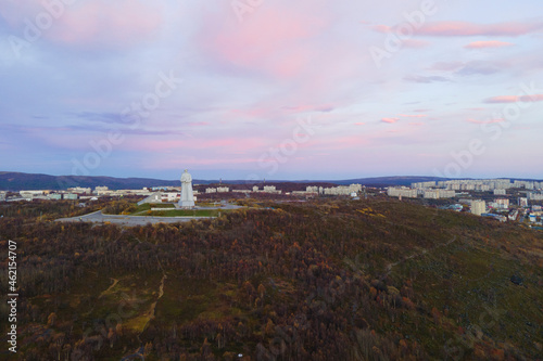 Aerial view panorama of city monument Defenders of Soviet Arctic Alyosha .