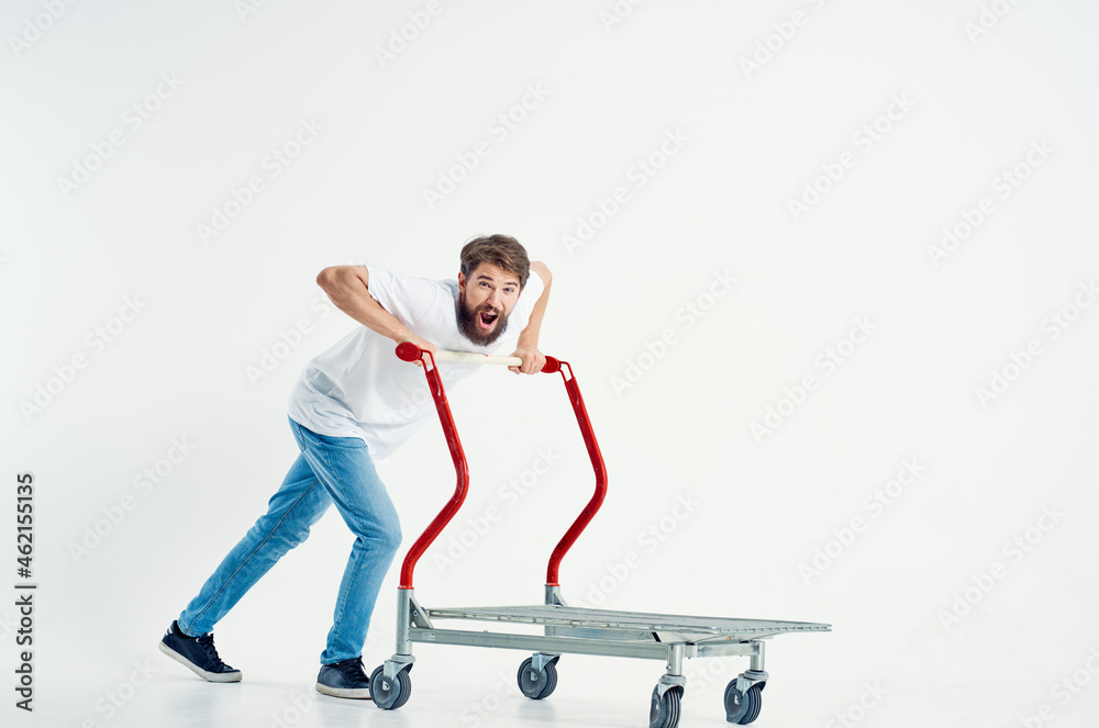 bearded man in a white t-shirt transport in a box light background bearded man in a white t-shirt transport in a box light background