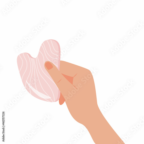 Gua Sha scraping massage tool holding by hand. Natural pink rose quartz stone scraper. Facial massage. Face lifting. Skin care. Trendy beauty treatment. Vector flat illustration isolated on white.