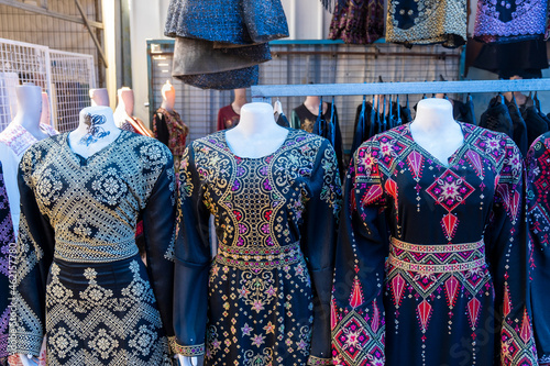 Canvas-taulu Traditional arabic women embroidered dresses sold at the bedouin market