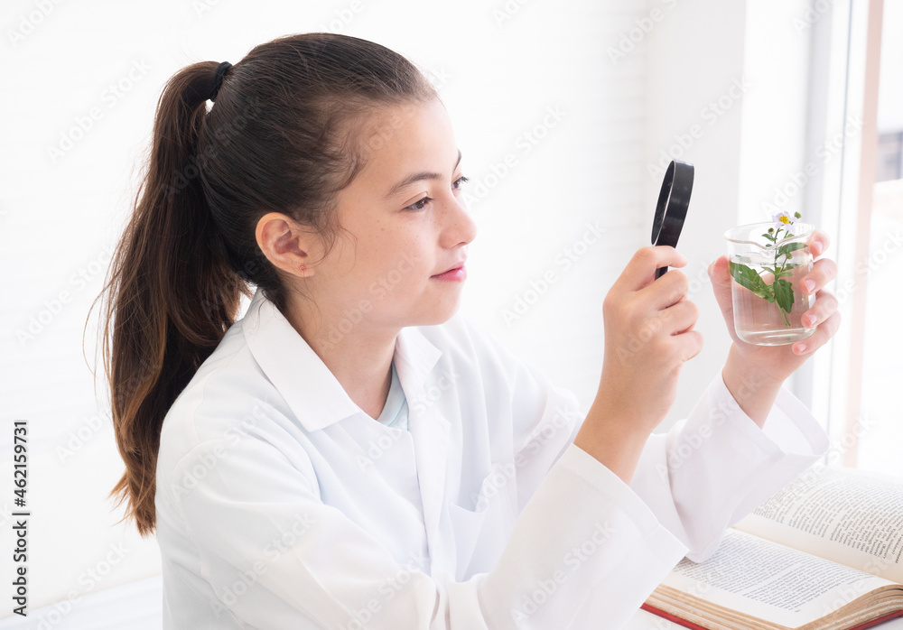 Little girl scientist making experiments in laboratory. Educational concept. Early development of children. Little girl scientist making experiments in laboratory. Educational concept. Early development of children.