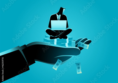 Giant hand holding a businessman who works on laptop on money stack
