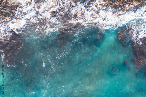 Aerial view of waves splashing on beach
