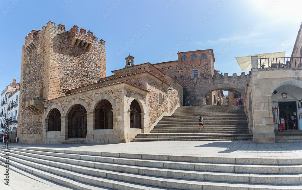 View at the Torre Bujaco, Arco de la Estrella and other heritage buildings on Plaza Mayor in Cáceres city downtown View at the Torre Bujaco, Arco de la Estrella and other heritage buildings on Plaza Mayor in Cáceres city downtown