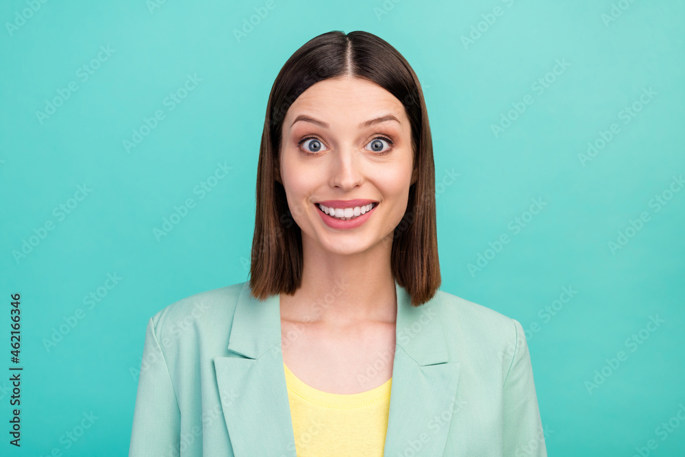Fototapeta premium Photo of impressed young brunette lady wear blazer isolated on cyan color background