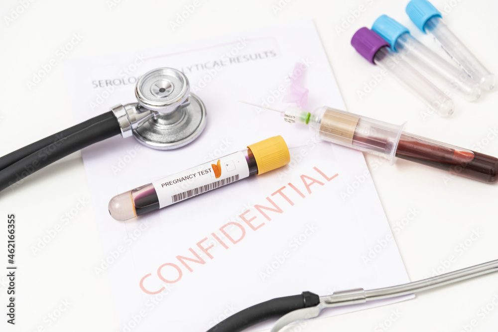Close-up of positive blood sample pregnancy test Close-up of positive blood sample pregnancy test