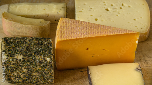 Several types of cheese on a board photo