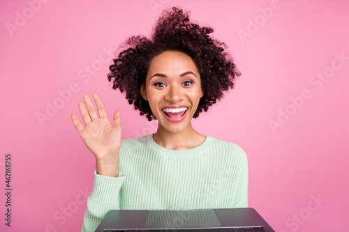 Photo of excited attractive dark skin lady arm palm wave speak communicate isolated on pink color background