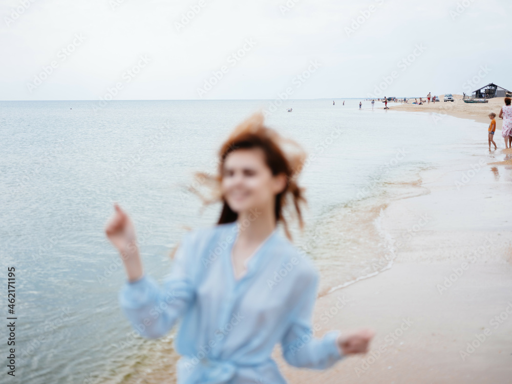 Woman in dress nature beach sand walk vacation Woman in dress nature beach sand walk vacation