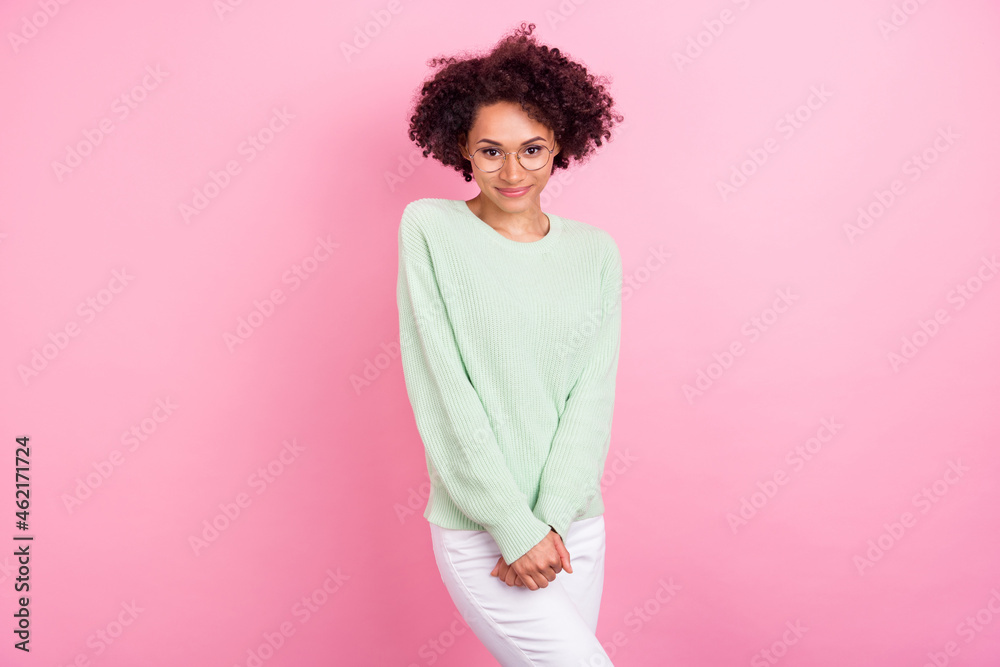 Photo of charming cheerful dark skin lady arms hold look camera isolated on bright color background