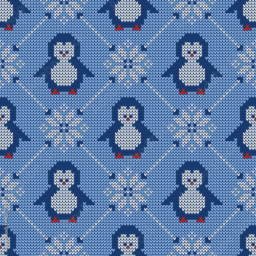 Knitted seamless pattern with penguins and scandinavian ornament. Winter sweater background. Vector illustration. photo