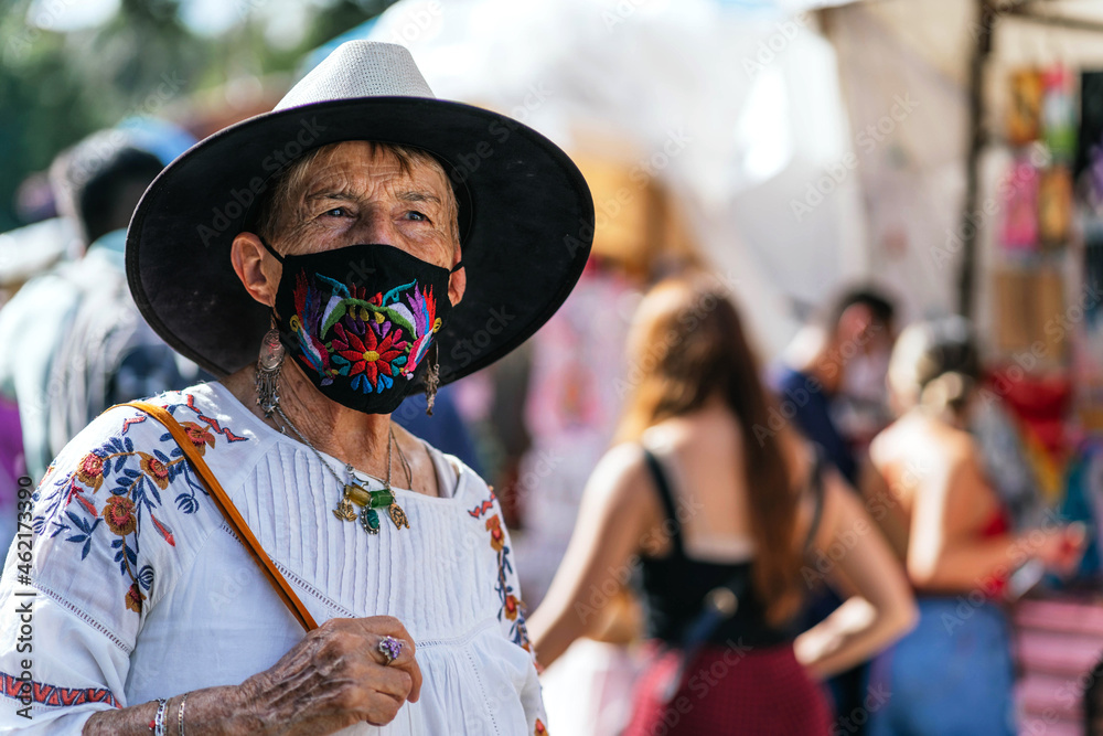 elderly woman strolling outdoors with mask elderly woman strolling outdoors with mask
