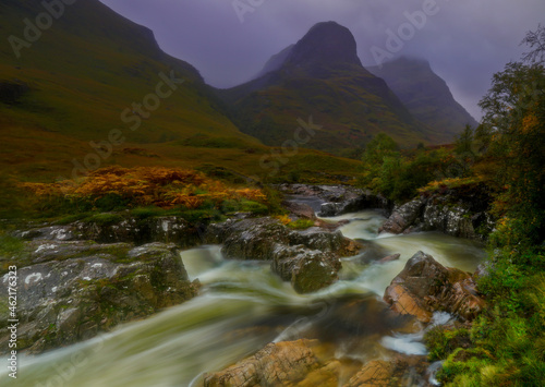 The River Coe, Glencoe, Highlands, Scotland with the three sisters mountains in the background.
