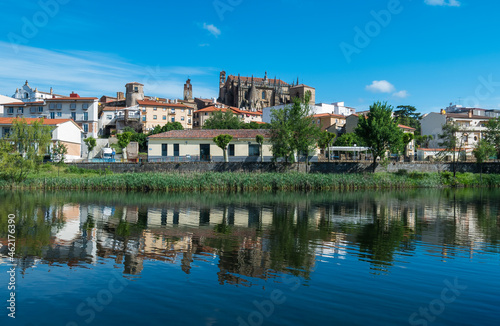 Plasencia city skyline with the Jerte river in the foreground and the cathedral in the background