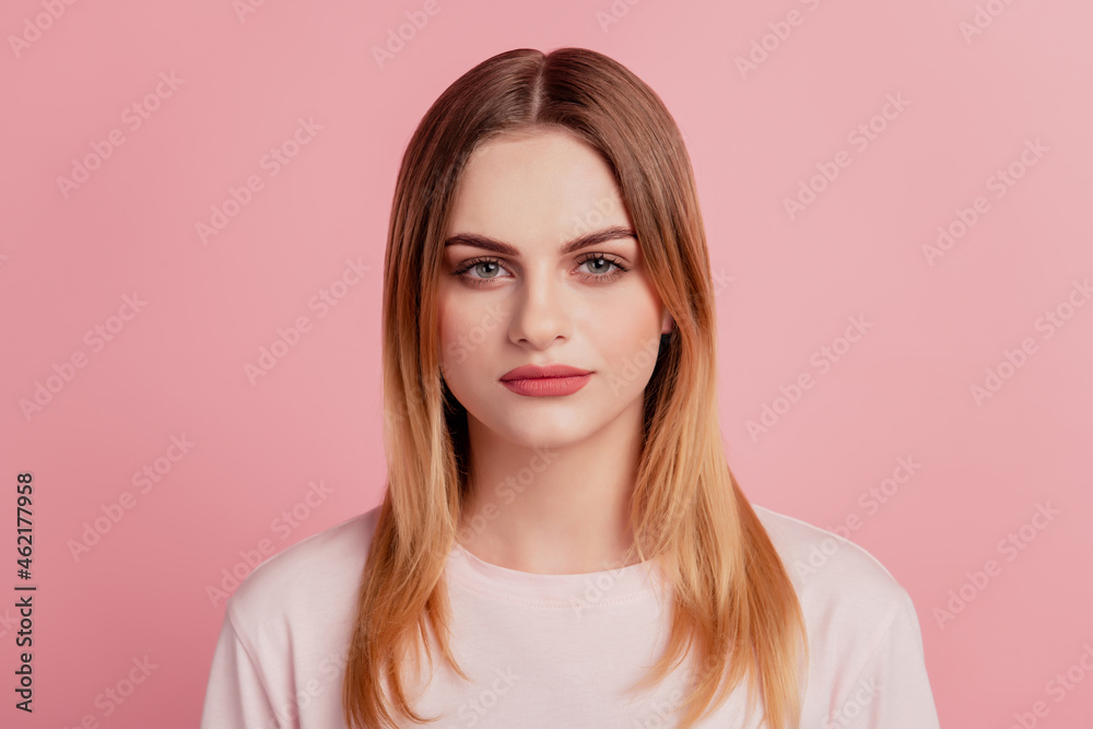 Photo of serious charming young woman confident clever casual outfit isolated on pastel blue color background Photo of serious charming young woman confident clever casual outfit isolated on pastel blue color background