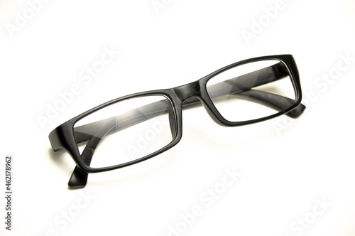 Reading glasses with black frames on a white background