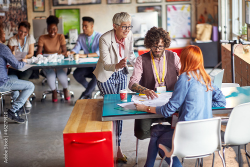 Senior colleague mentoring young employees