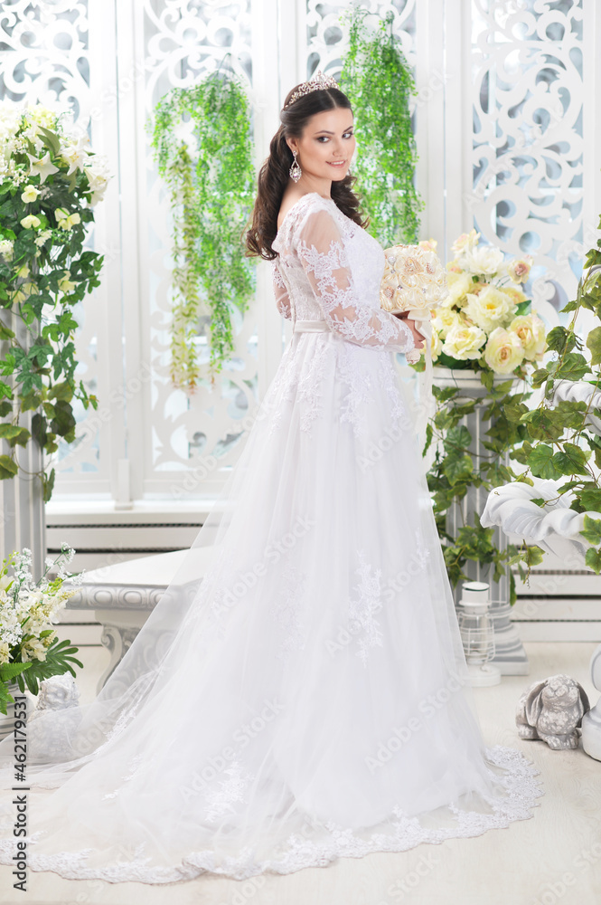 Portrait of young beautiful bride in white dress posing Portrait of young beautiful bride in white dress posing