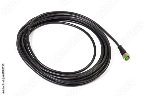Coiled black cable with electric socket on the end