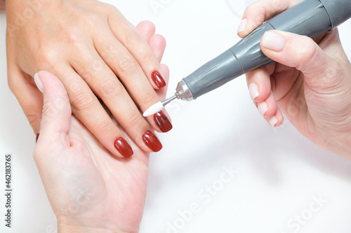 Beautician Salon  Manicure. Professional hardware manicure using electric machine in beauty salon.