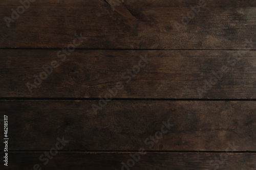 Old dark brown wooden background. Timber board texture