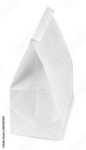 Closed paper grocery bag isolated on white