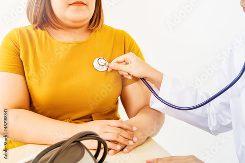 Female doctors use a stethoscope to diagnose, listen to obesity patients, examine symptoms, and recommend treatment methods for obesity, obesity health care and modern medical concepts in hospitals.