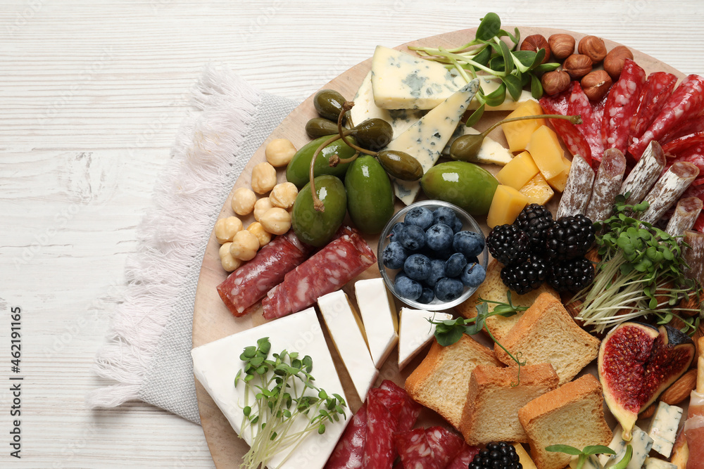 Different tasty appetizers on white wooden table, top view Different tasty appetizers on white wooden table, top view