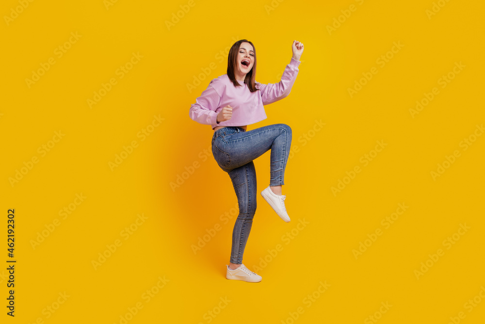 Full body profile side photo of young excited girl celebrate win lottery isolated over yellow color background
