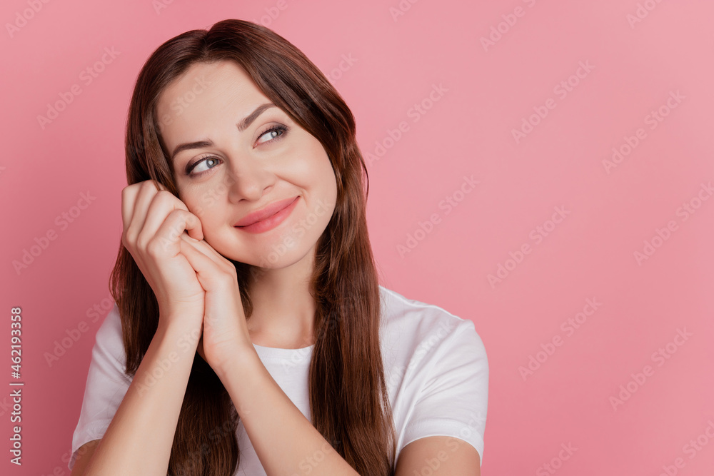Portrait of cute lovely pretty positive girl palms cheek look empty space on pink background Portrait of cute lovely pretty positive girl palms cheek look empty space on pink background