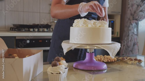 Wallpaper Mural Woman chef decorating handmade cake with chocolate on the serving plate Torontodigital.ca