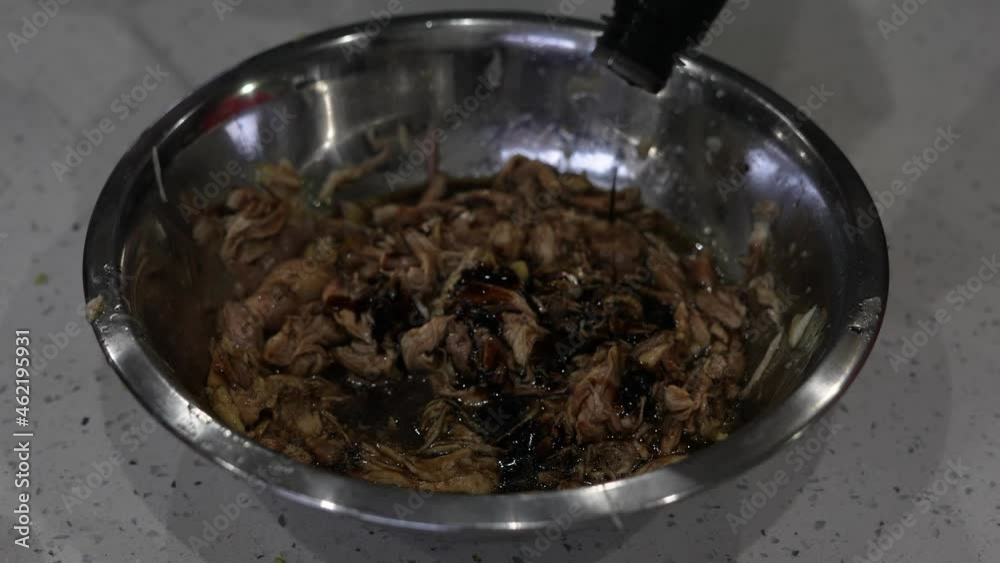 adding chinese sauce to chicken meat in a wok adding chinese sauce to chicken meat in a wok