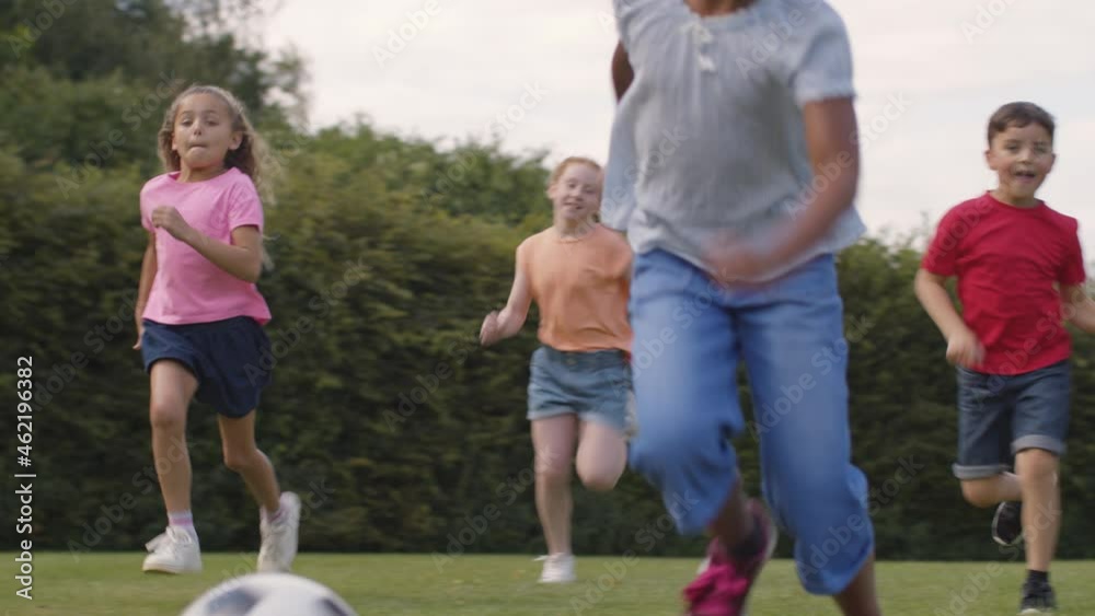 Tracking Shot of Group of Children Playing Football 05 Tracking Shot of Group of Children Playing Football 05