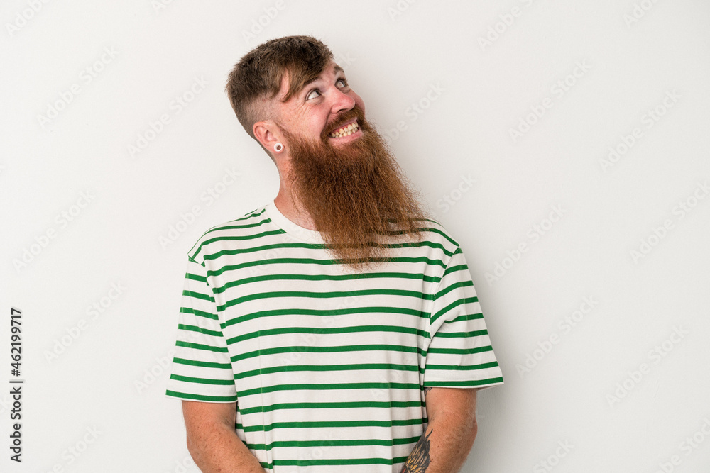 Young caucasian ginger man with long beard isolated on white background relaxed and happy laughing, neck stretched showing teeth. Young caucasian ginger man with long beard isolated on white background relaxed and happy laughing, neck stretched showing teeth.