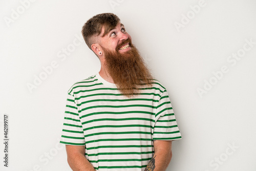 Young caucasian ginger man with long beard isolated on white background relaxed and happy laughing, neck stretched showing teeth.