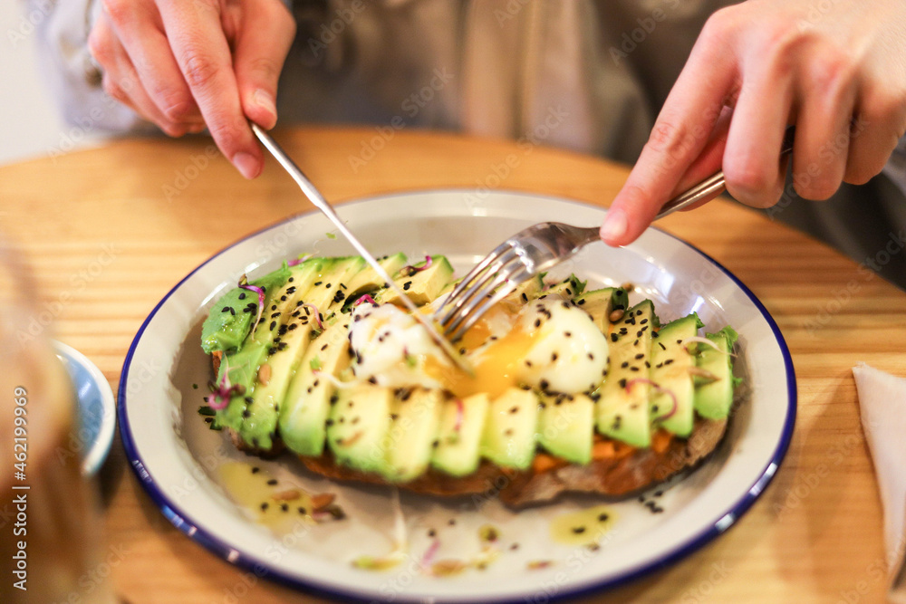 breakfast of avocado toast with egg and coffee with milk breakfast of avocado toast with egg and coffee with milk