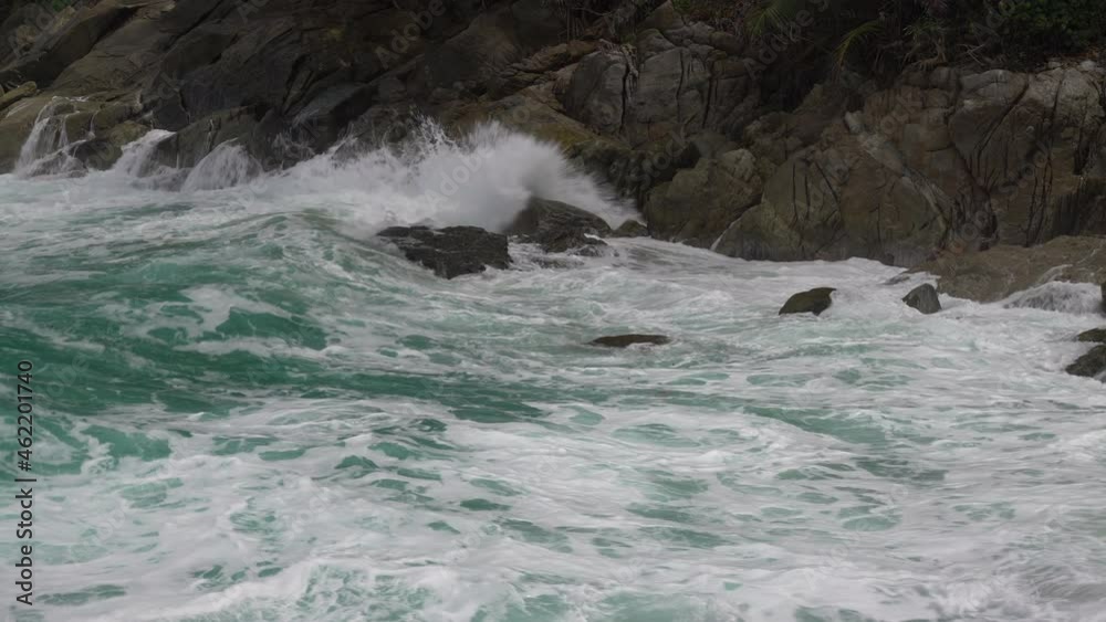 Close up of Sea waves crash on the rocks of the coast creating an explosion of water Close up of Sea waves crash on the rocks of the coast creating an explosion of water