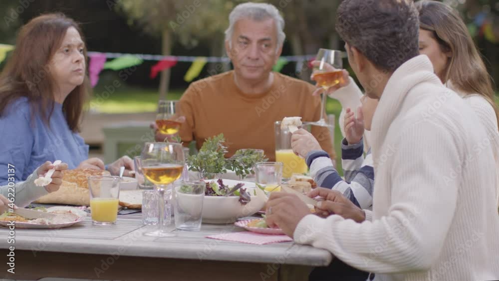 Tracking Shot of Family Eating Al Fresco Dinner 02 Tracking Shot of Family Eating Al Fresco Dinner 02