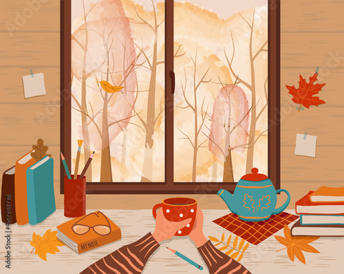 Hands with mug of coffee on the table. Outside the window is an autumn landscape. Teapot, books, pencils, color leaves, glasses and  notebook on the table. Vector illustration in flat style