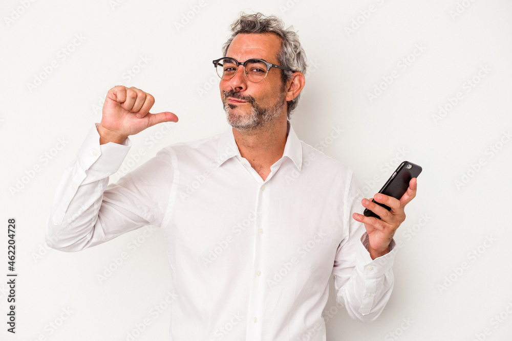 Middle age caucasian business man holding a mobile phone isolated on white background feels proud and self confident, example to follow. Middle age caucasian business man holding a mobile phone isolated on white background feels proud and self confident, example to follow.