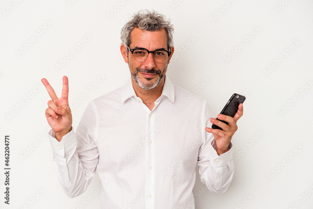 Middle age caucasian business man holding a mobile phone isolated on white background showing number two with fingers. Middle age caucasian business man holding a mobile phone isolated on white background showing number two with fingers.