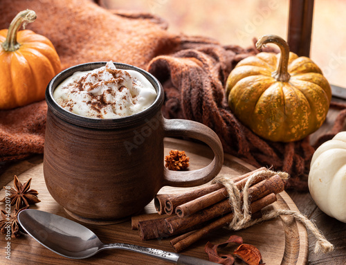 Pumpkin spice latte with autumn background